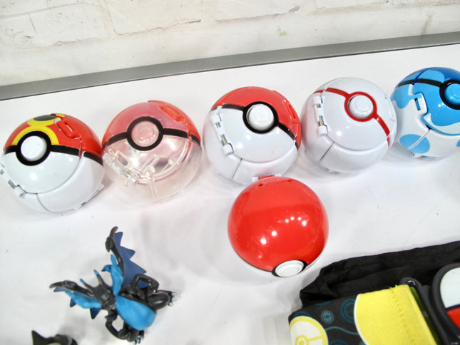 Collection of Pokemon 10 Pokeballs and 11 Figurines with Pouch