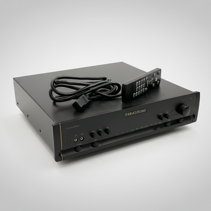 Parasound Halo P6 with remote and power cord over grey background.